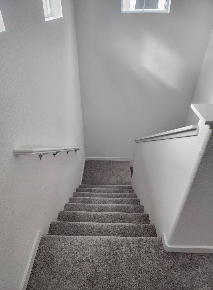 Staircase — Hardwood to LVP before