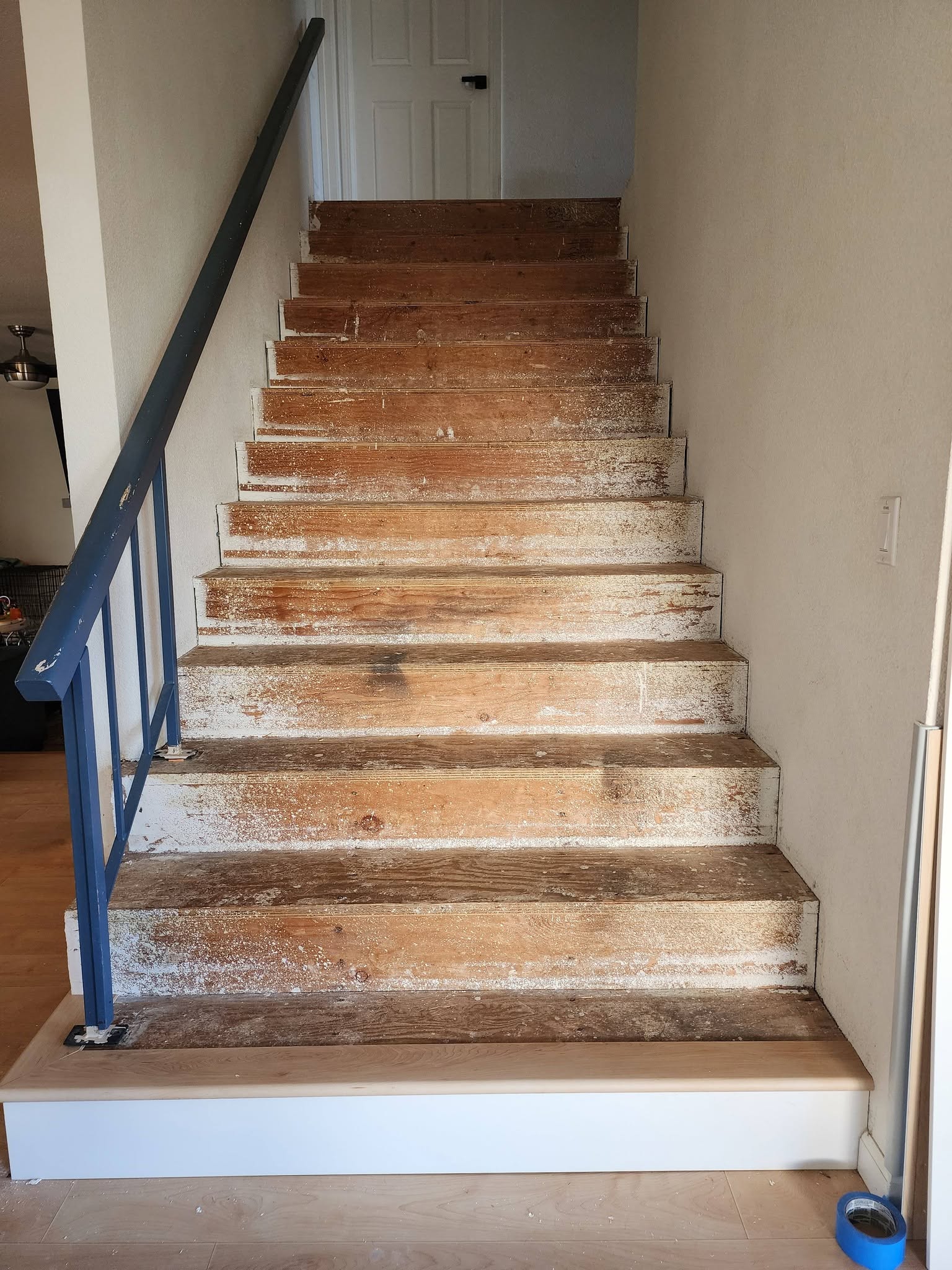 Staircase — LVP with White Risers before