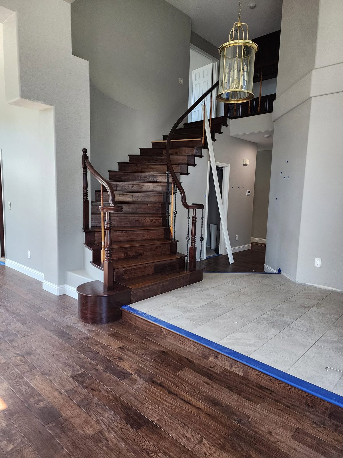 Curved Staircase — Dark Hardwood