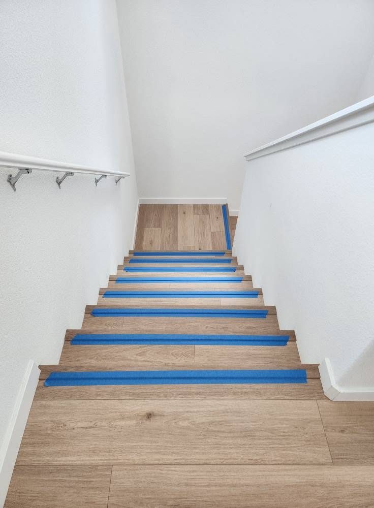 Staircase — Hardwood to LVP after