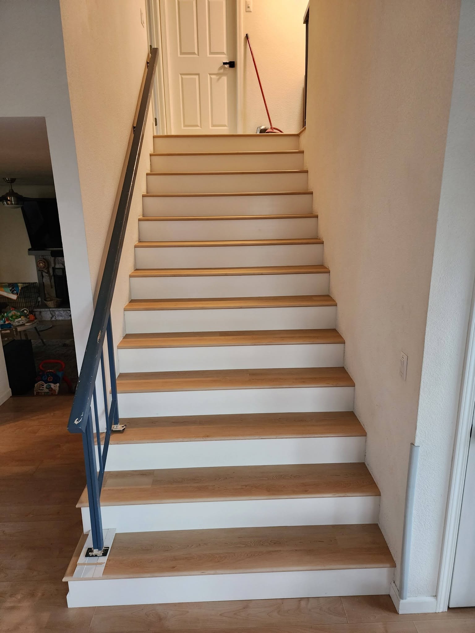 Staircase — LVP with White Risers after